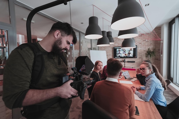 scene-cameraman-recording-group-young-multiethnic-business-people-working-commun